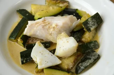 Recipe or fish steamed over a bed of zucchinis