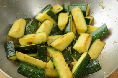 Cooking the zucchinis for the fish