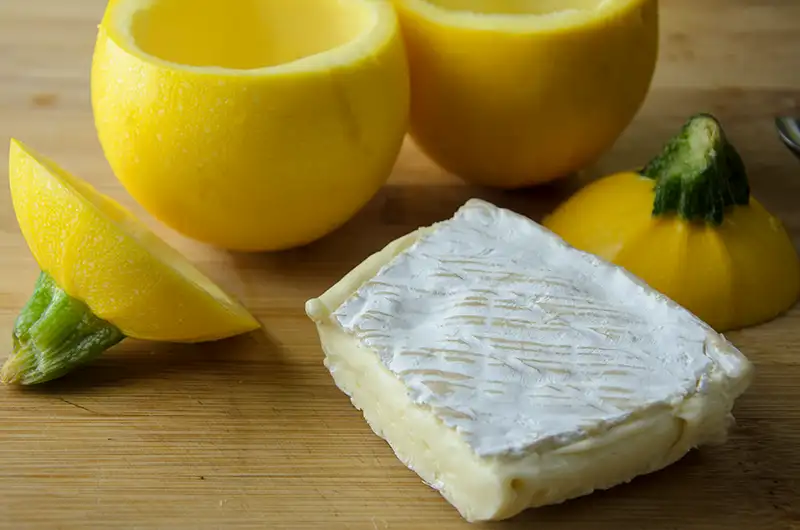 French Brie and yellow round zucchini